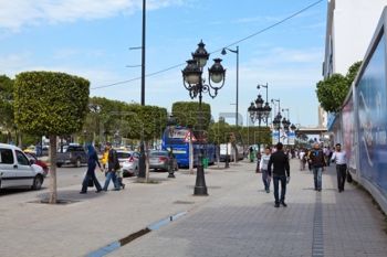 Avenue Bourghiba, the  central thoroughfare of Tunis. Note the carefully clipped trees