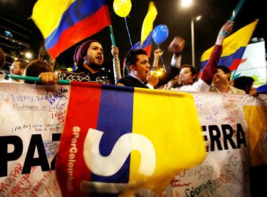 People celebrate in Bogota after the Colombian government and the Revolutionary Armed Forces of Colombia signed a peace deal 